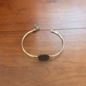 1 Gold sand dollar bracelet.